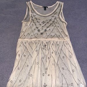 Pinkish see through dress with brown rhinestones details